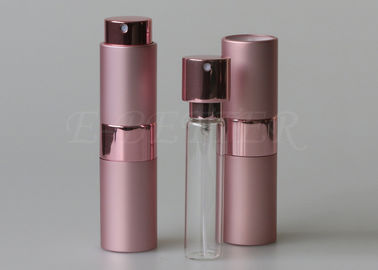 Torsión rosada y Spritz las botellas vacías del espray de perfume del atomizador con la cabeza