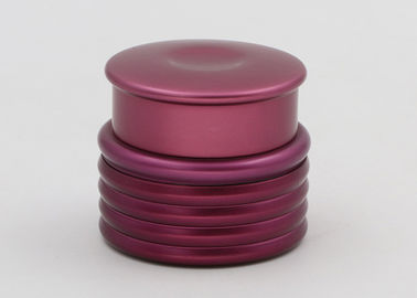 Los tarros cosméticos de cristal púrpuras, los envases poner crema de cristal para baten y las lociones